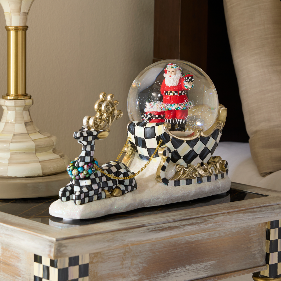 Collectible Snow Globes image features Dashing Through The Snow Globe of Santa on a Courtly Check sleigh pulled by a Courtly Check Reindeer