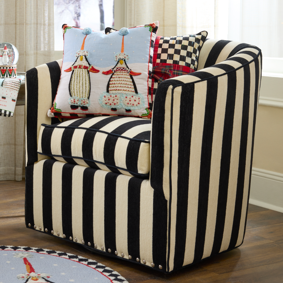 Seasonal Hosting Statement Pieces - living room image of marquee chair paired with festive pillows
