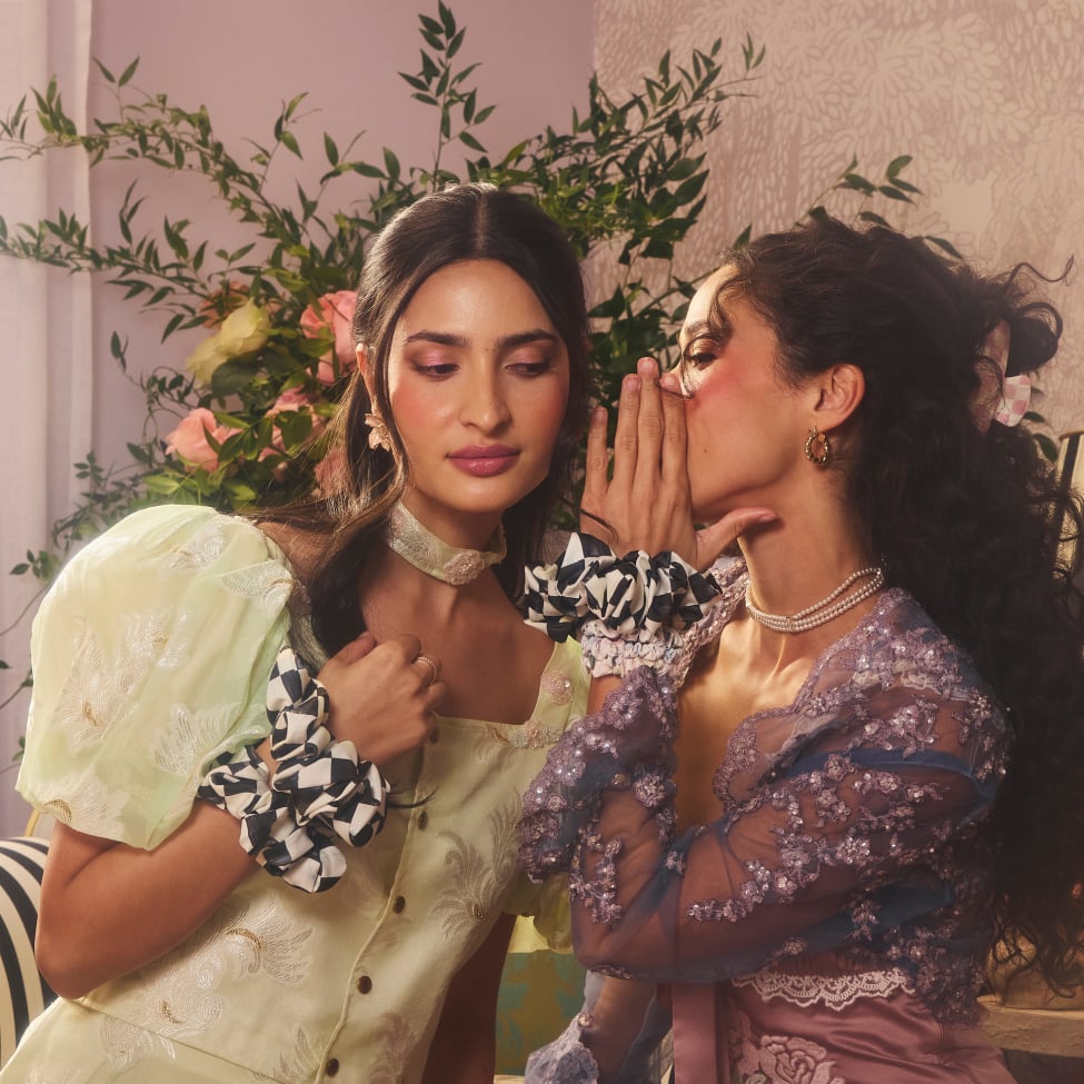 Coming Soon: Hair Magic In Full Bloom - image features models with accessories whispering